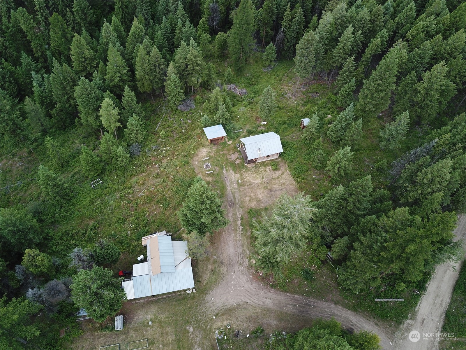 177 1st Creek Road Danville, WA 99121 - Photo 2 of 29 an aerial view of a house with a yard and trees