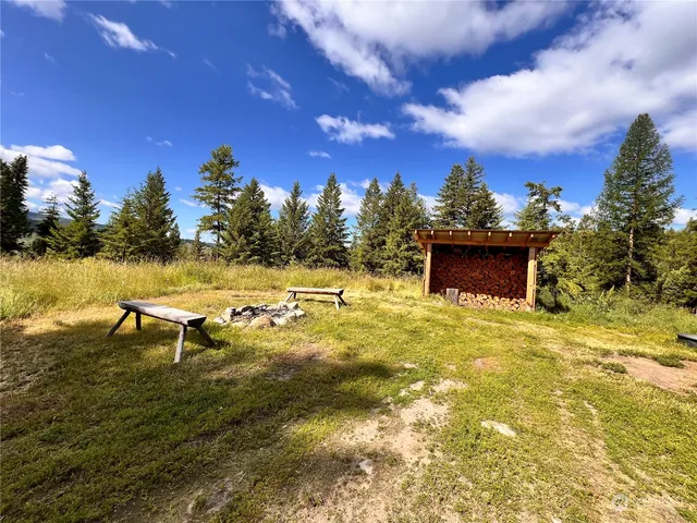 a view of a swimming pool with a yard