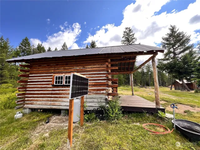 a view of a backyard with sitting area