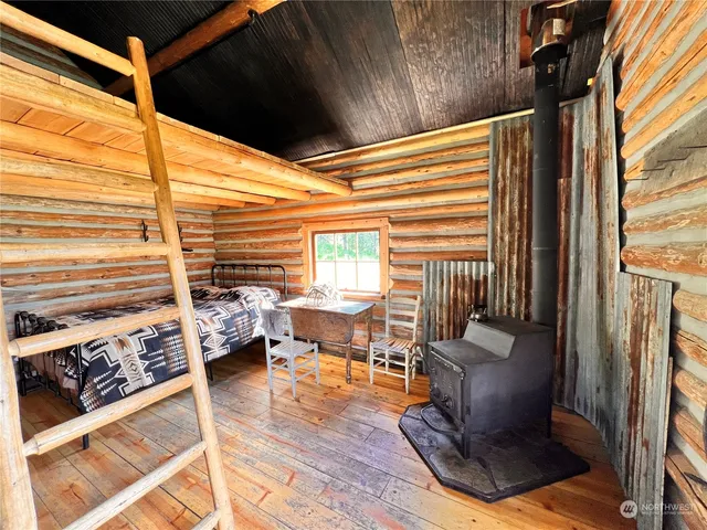 a view of living room with patio furniture and a floor to ceiling window