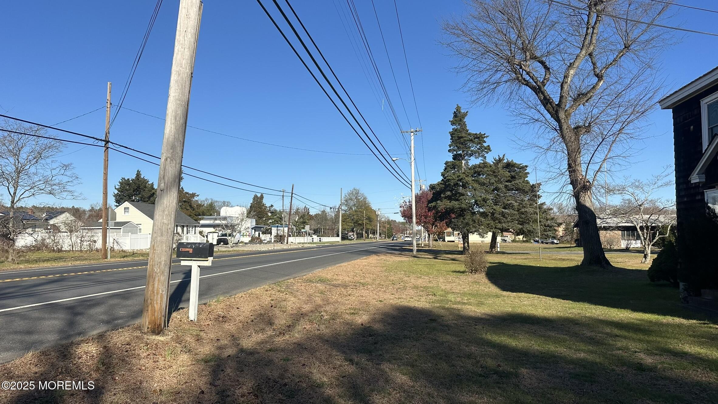 295 North Main Street Manahawkin, NJ 08050 - Photo 2 of 16 a view of a street with houses