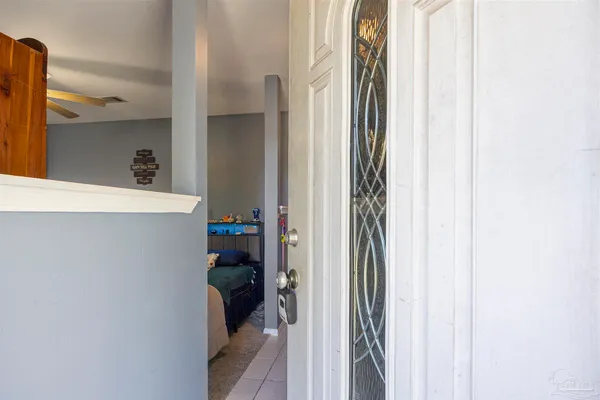 a bed room with a bed and a mirror