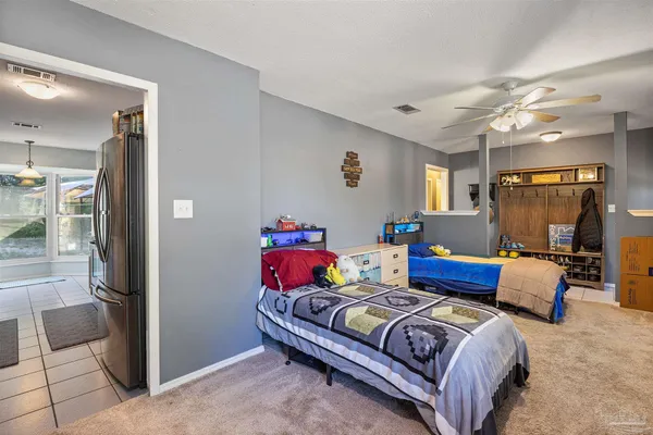 a bedroom with bed and window