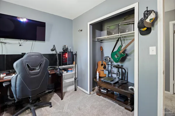 a bedroom with a bed and a tv in it