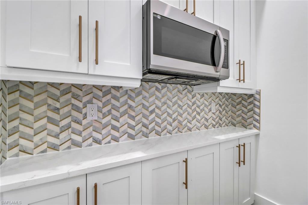 733 15th Street Southwest Naples, FL 34117 - Photo 13 of 34 a bathroom with a sink and a mirror