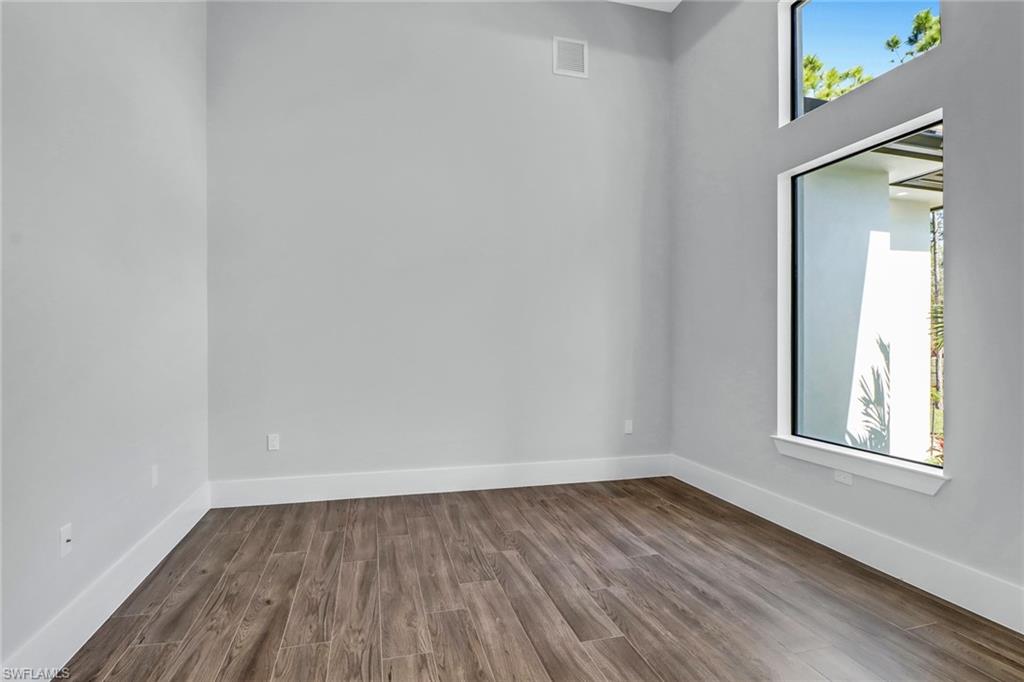 733 15th Street Southwest Naples, FL 34117 - Photo 14 of 34 an empty room with a window