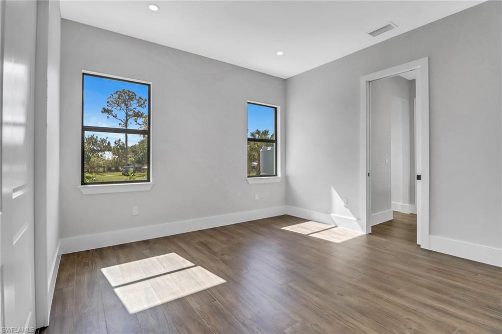 733 15th Street Southwest Naples, FL 34117 - Photo 22 of 34 a view of an empty room window and wooden floor