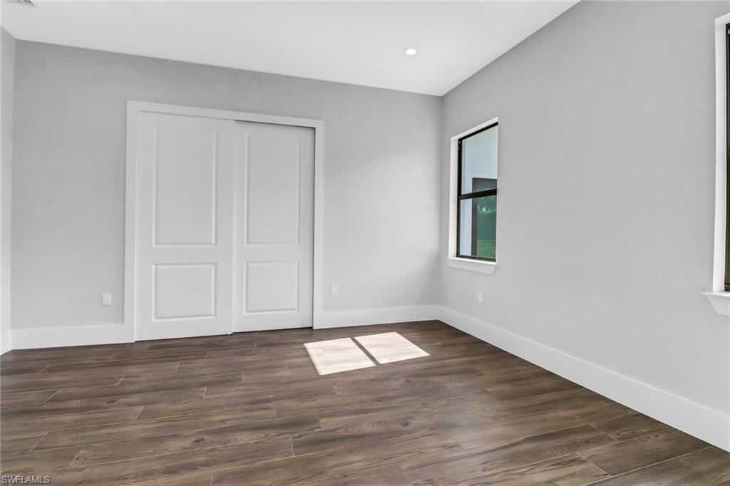 733 15th Street Southwest Naples, FL 34117 - Photo 23 of 34 a view of an empty room with wooden floor