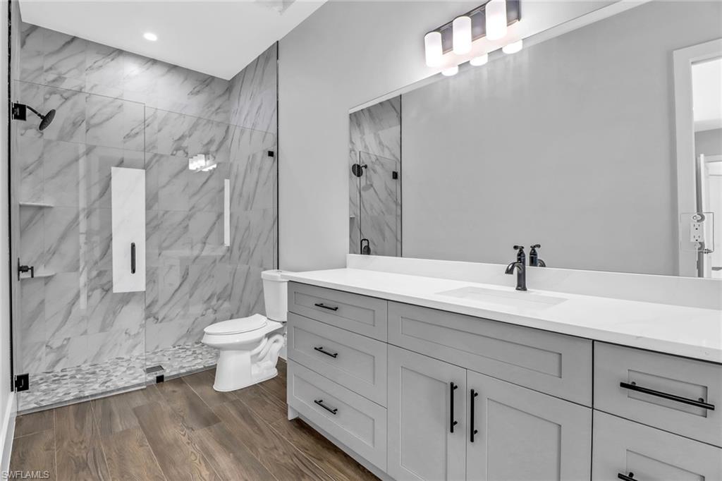 733 15th Street Southwest Naples, FL 34117 - Photo 28 of 34 a bathroom with a sink a toilet and shower