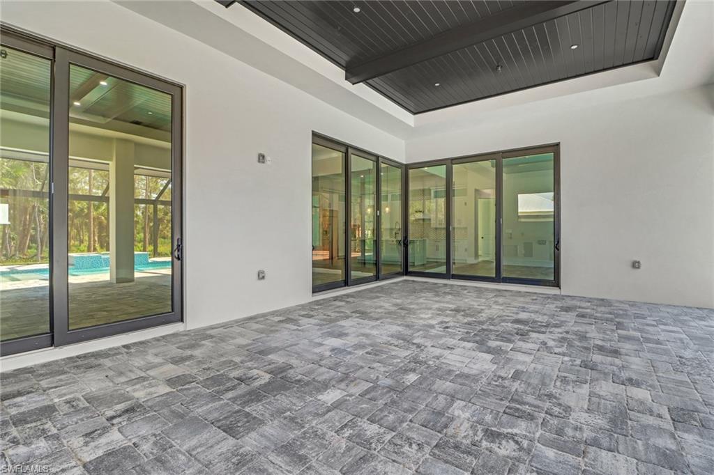 733 15th Street Southwest Naples, FL 34117 - Photo 33 of 34 a view of an empty room with glass door and balcony