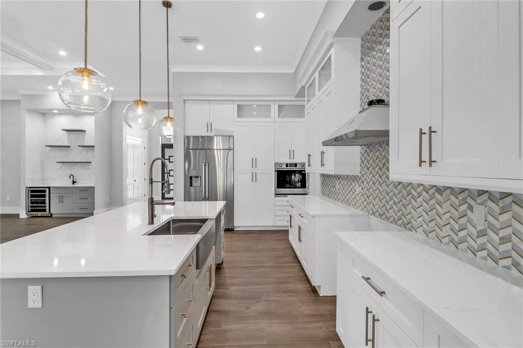 733 15th Street Southwest Naples, FL 34117 - Photo 10 of 34 a spacious bathroom with double vanity and a shower
