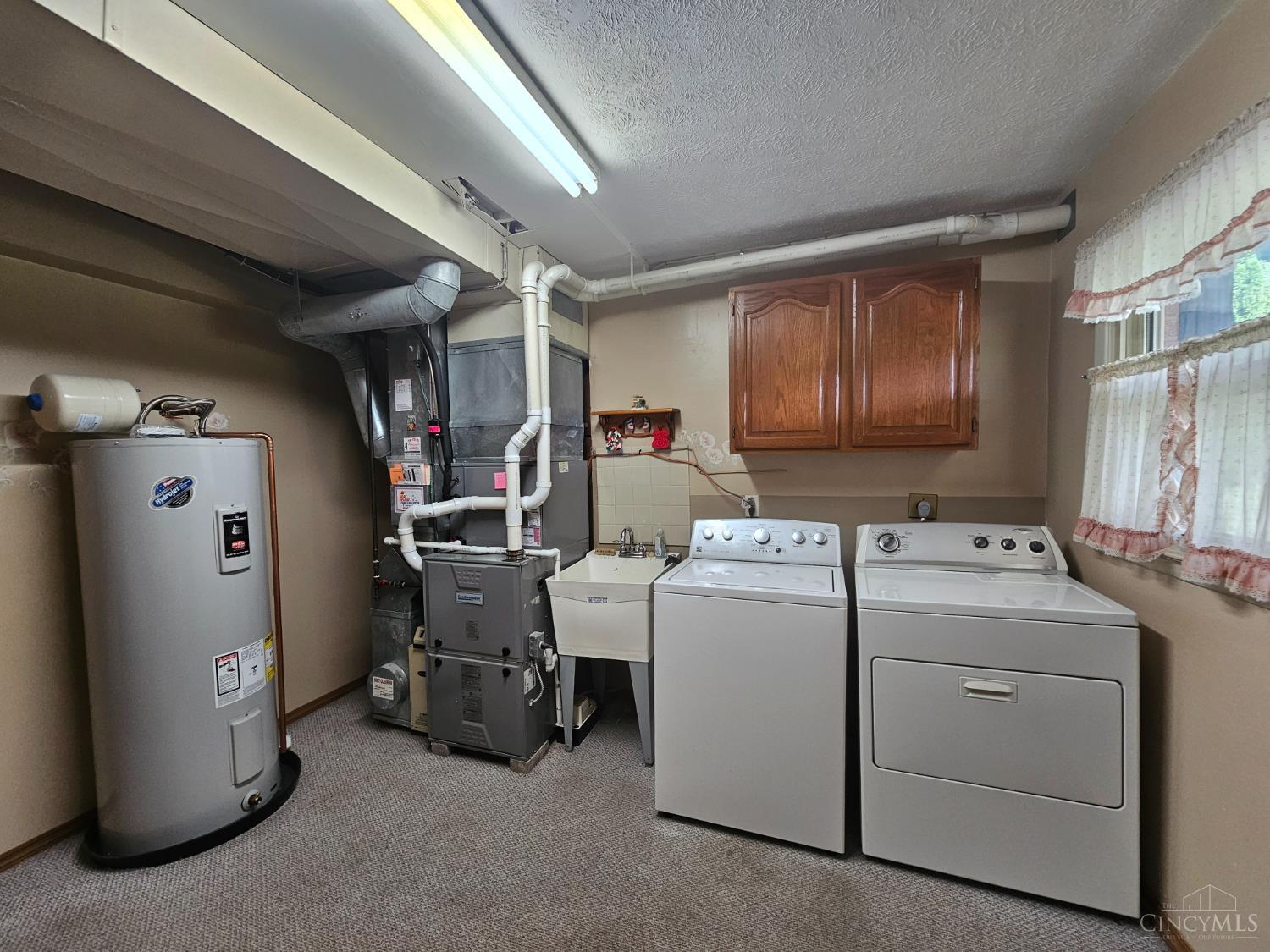 9773 West Road Harrison, OH 45030 - Photo 37 of 50 Spacious laundry room. Furnace, a/c and WH was installed in 2016.