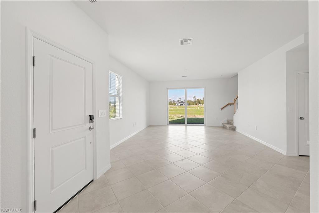 14792 Bluewater Road Babcock Ranch, FL 33982 - Photo 11 of 42 a view of an empty room with a window