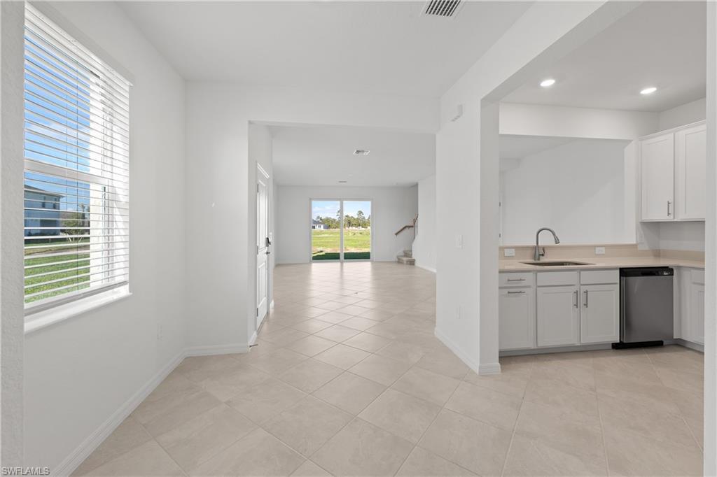 14792 Bluewater Road Babcock Ranch, FL 33982 - Photo 13 of 42 a view of a kitchen with a sink and a window