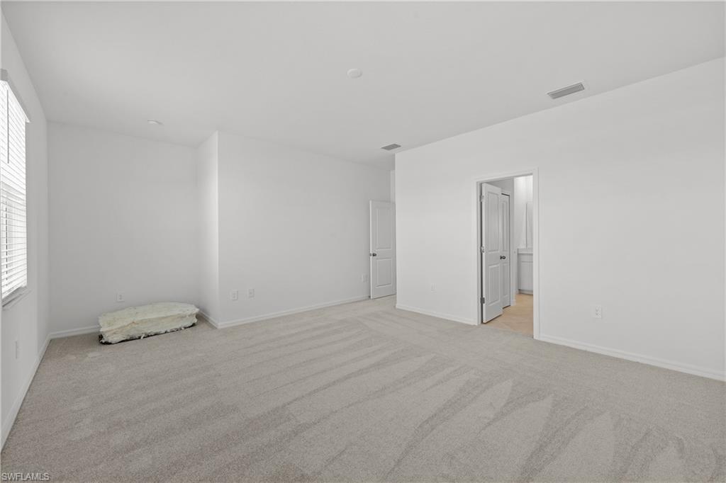 14792 Bluewater Road Babcock Ranch, FL 33982 - Photo 40 of 42 a view of an empty room and window