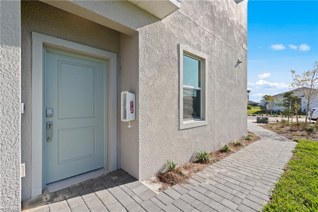14792 Bluewater Road Babcock Ranch, FL 33982 - Photo 4 of 42 a view of a house with a patio