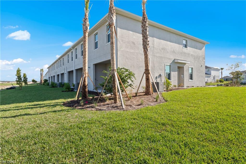 14792 Bluewater Road Babcock Ranch, FL 33982 - Photo 5 of 42 a view of a house with a yard