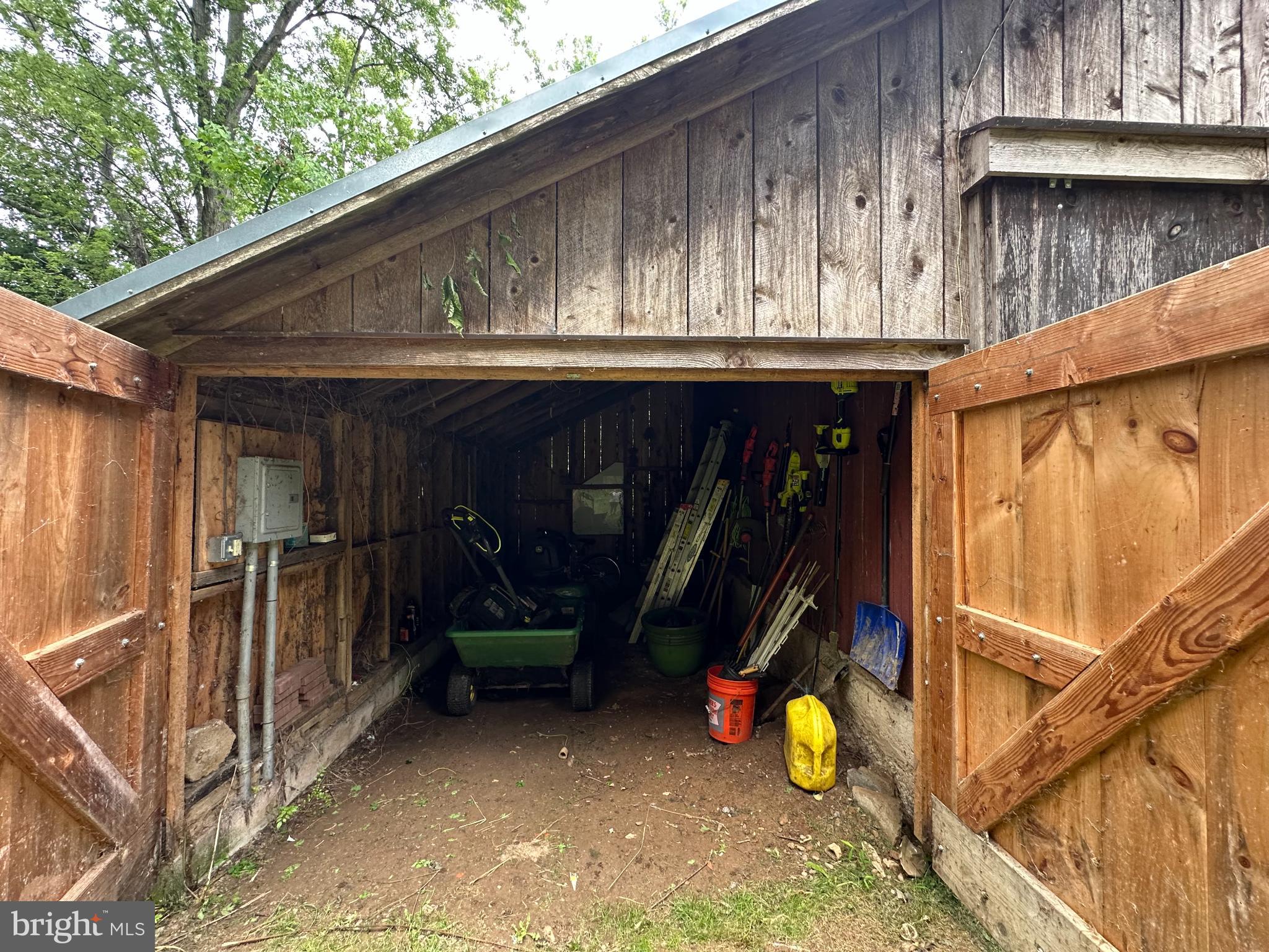 16756 Mount Airy Road Shrewsbury, PA 17361 - Photo 28 of 93 Rustic shed brimming with tools and charm.