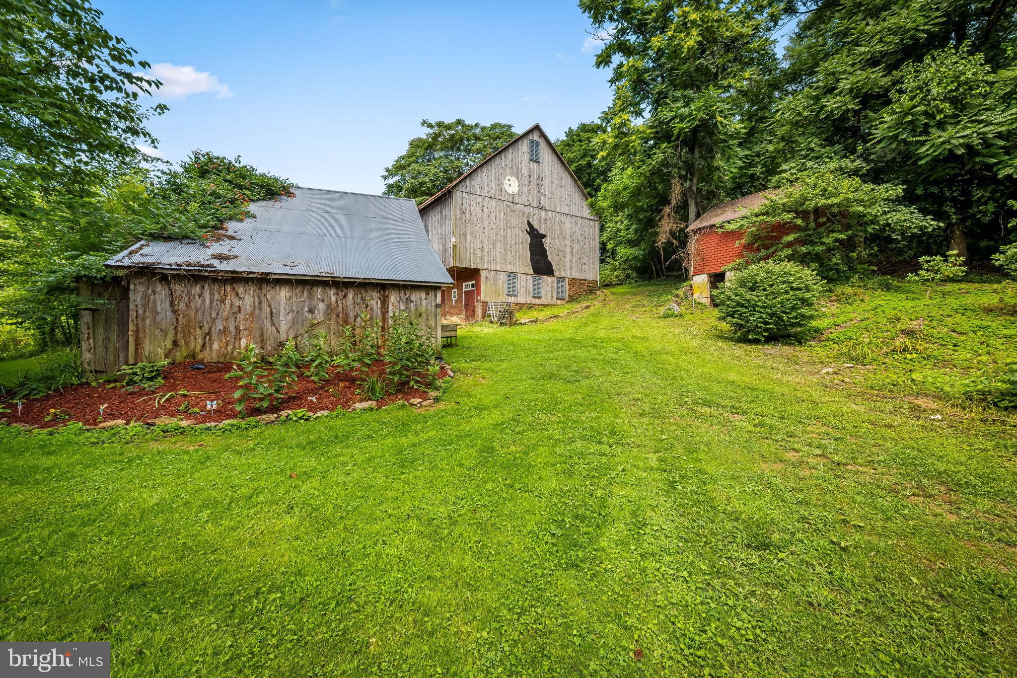 16756 Mount Airy Road Shrewsbury, PA 17361 - Photo 30 of 93 Charming rustic barn amidst lush greenery.