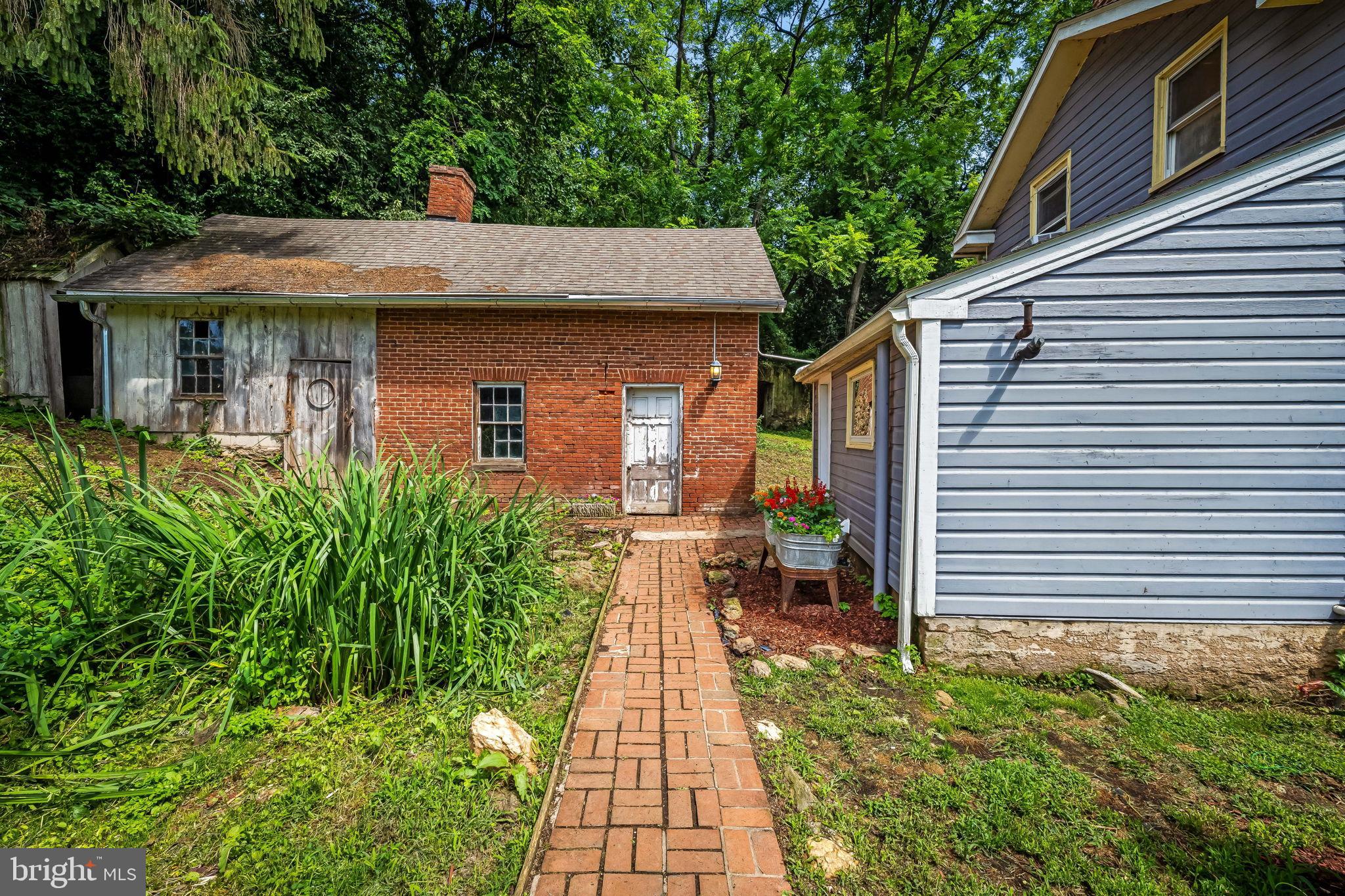 16756 Mount Airy Road Shrewsbury, PA 17361 - Photo 5 of 93 Charming dual-tone home with lush greenery.