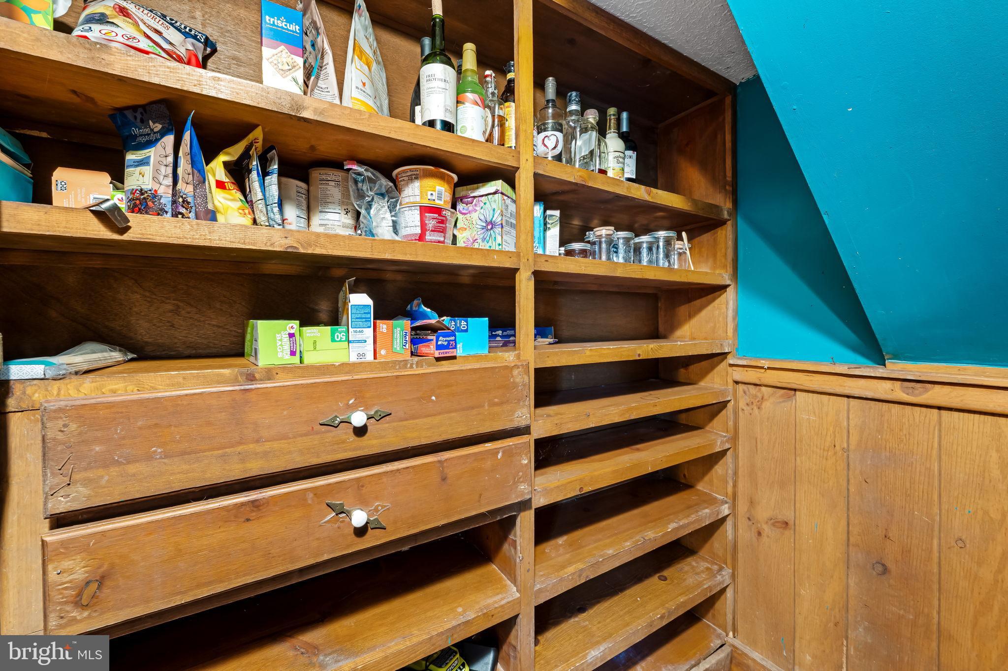 16756 Mount Airy Road Shrewsbury, PA 17361 - Photo 59 of 93 Charming pantry with rustic wooden shelves.