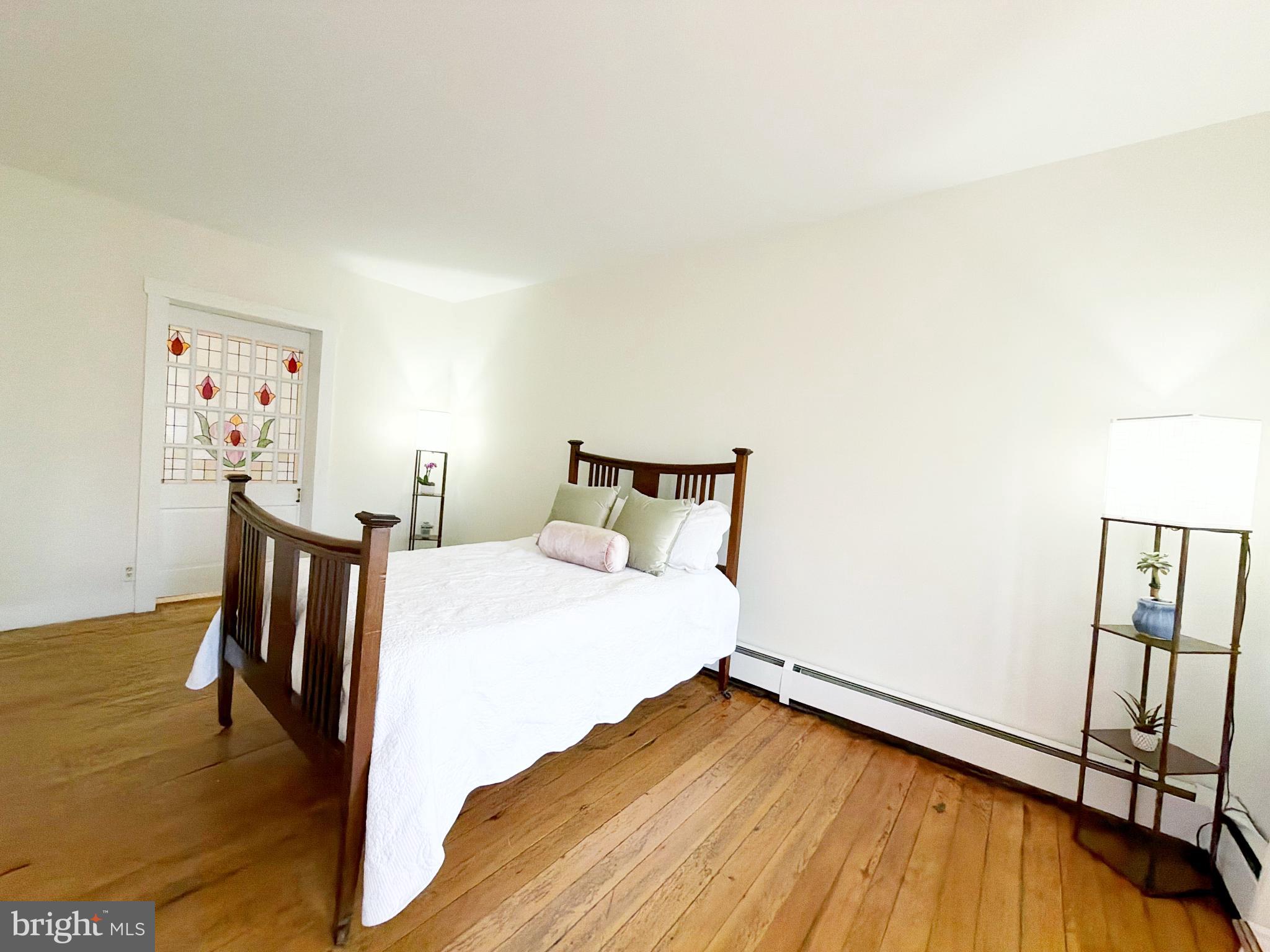 16756 Mount Airy Road Shrewsbury, PA 17361 - Photo 62 of 93 Bright and airy bedroom with wooden accents.