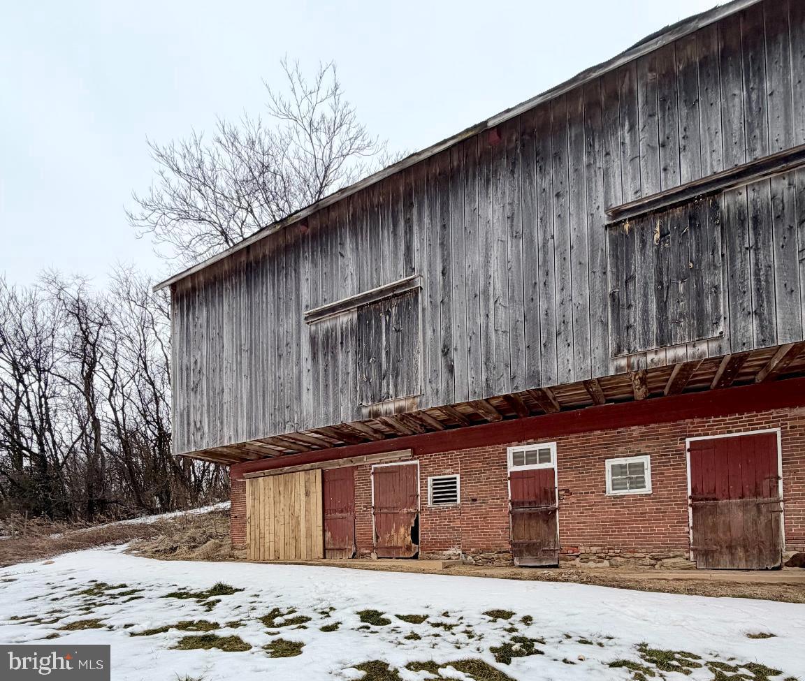 16756 Mount Airy Road Shrewsbury, PA 17361 - Photo 8 of 93 Rustic barn nestled in a snowy landscape.