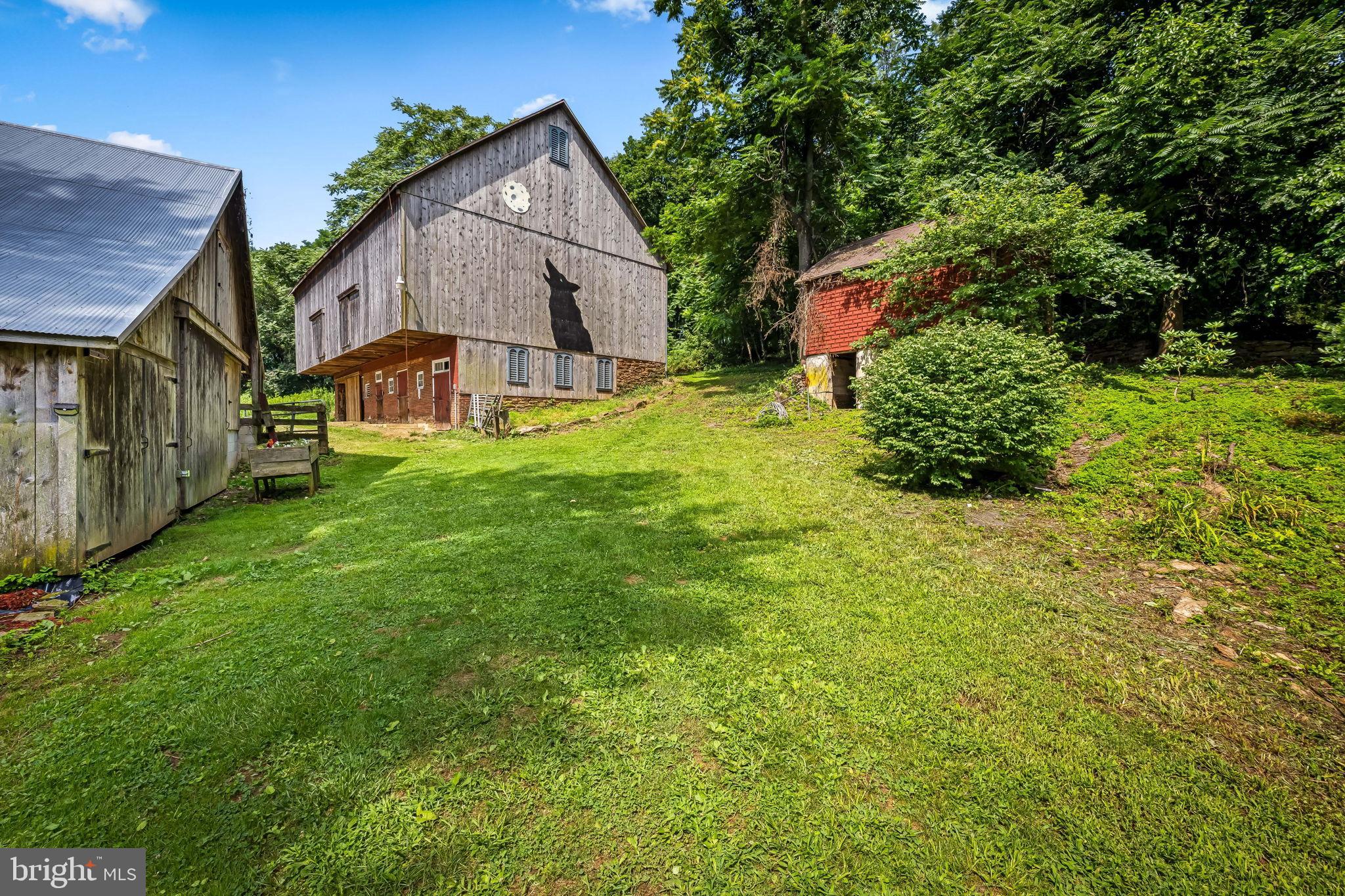 16756 Mount Airy Road Shrewsbury, PA 17361 - Photo 92 of 93 Charming rustic barn nestled in lush greenery.