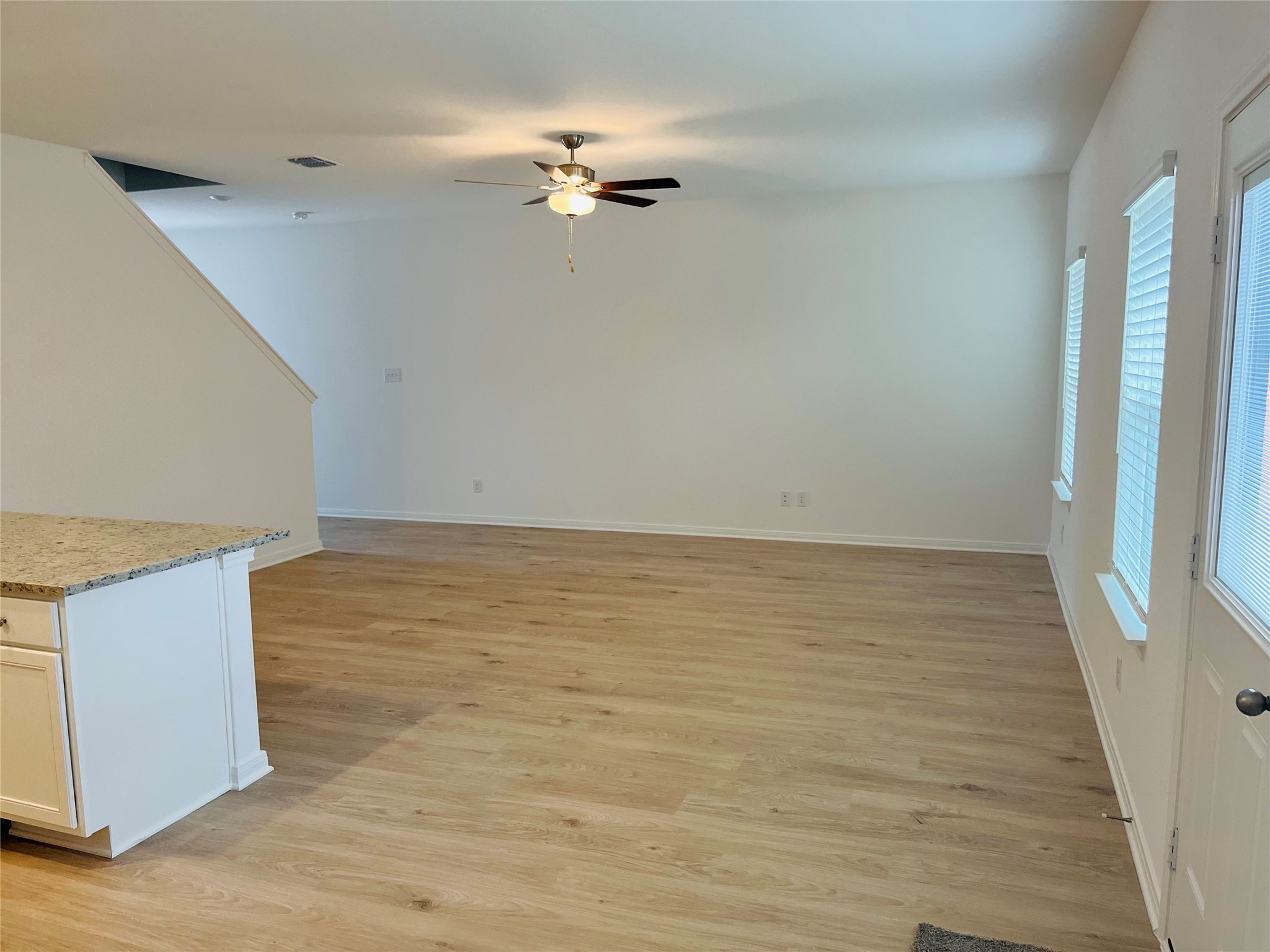 448 Aplite Pass Maxwell, TX 78656 - Photo 3 of 11 a view of an empty room with wooden floor