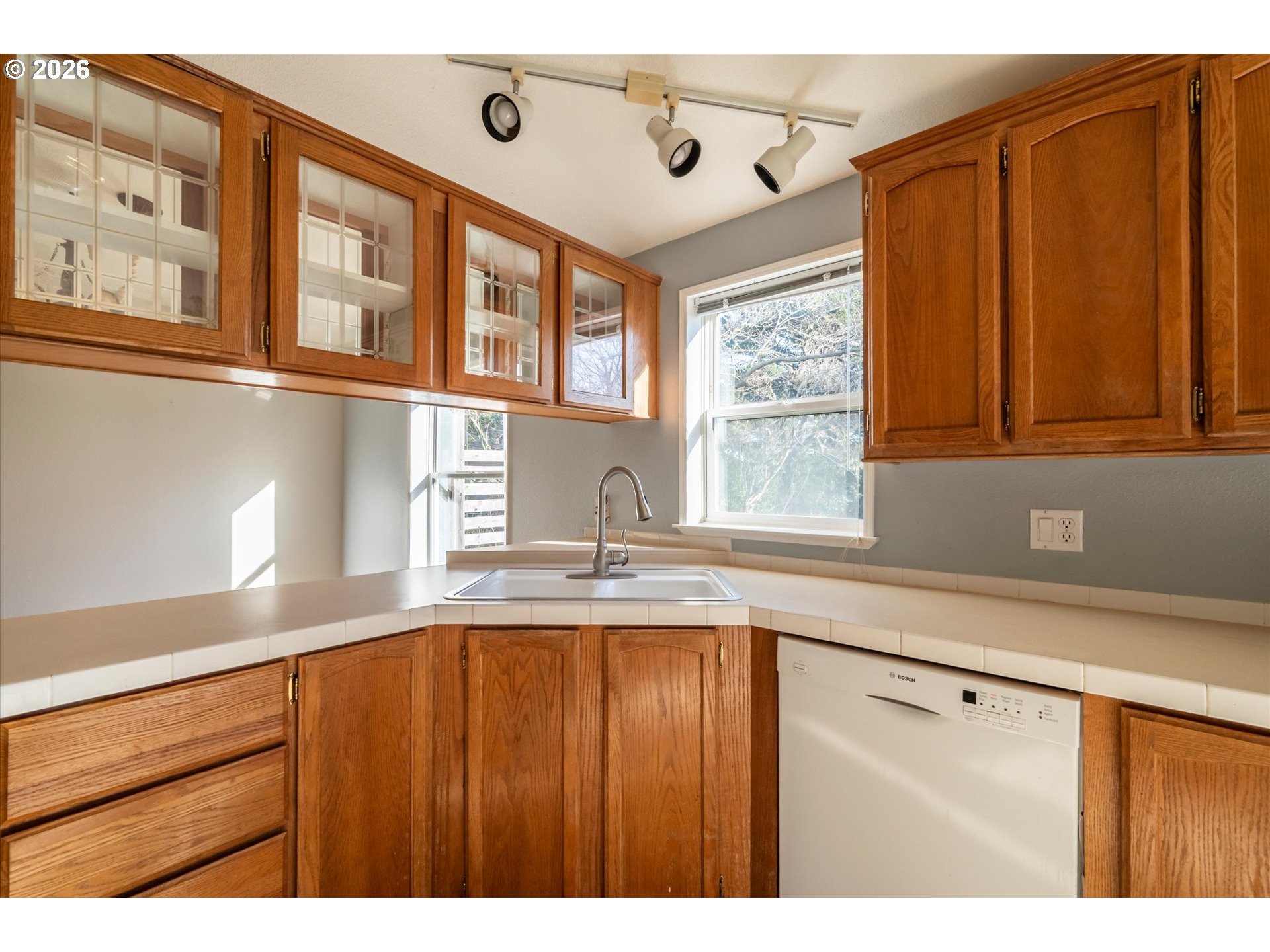 887 Jackson Avenue Southwest Bandon, OR 97411 - Photo 14 of 29 a kitchen with stainless steel appliances granite countertop a sink and cabinets