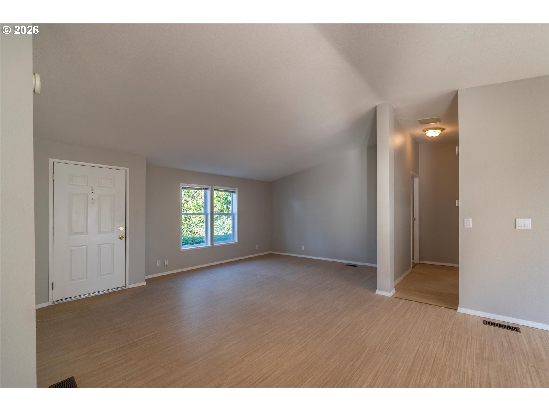 887 Jackson Avenue Southwest Bandon, OR 97411 - Photo 18 of 29 a view of an empty room and window