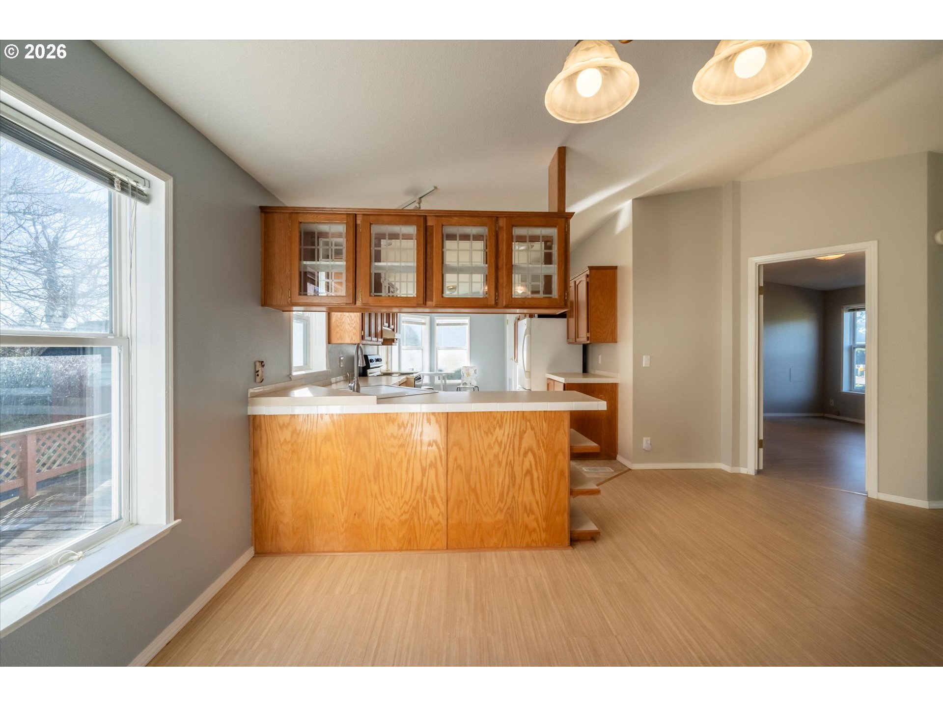 887 Jackson Avenue Southwest Bandon, OR 97411 - Photo 19 of 29 a kitchen with sink and window