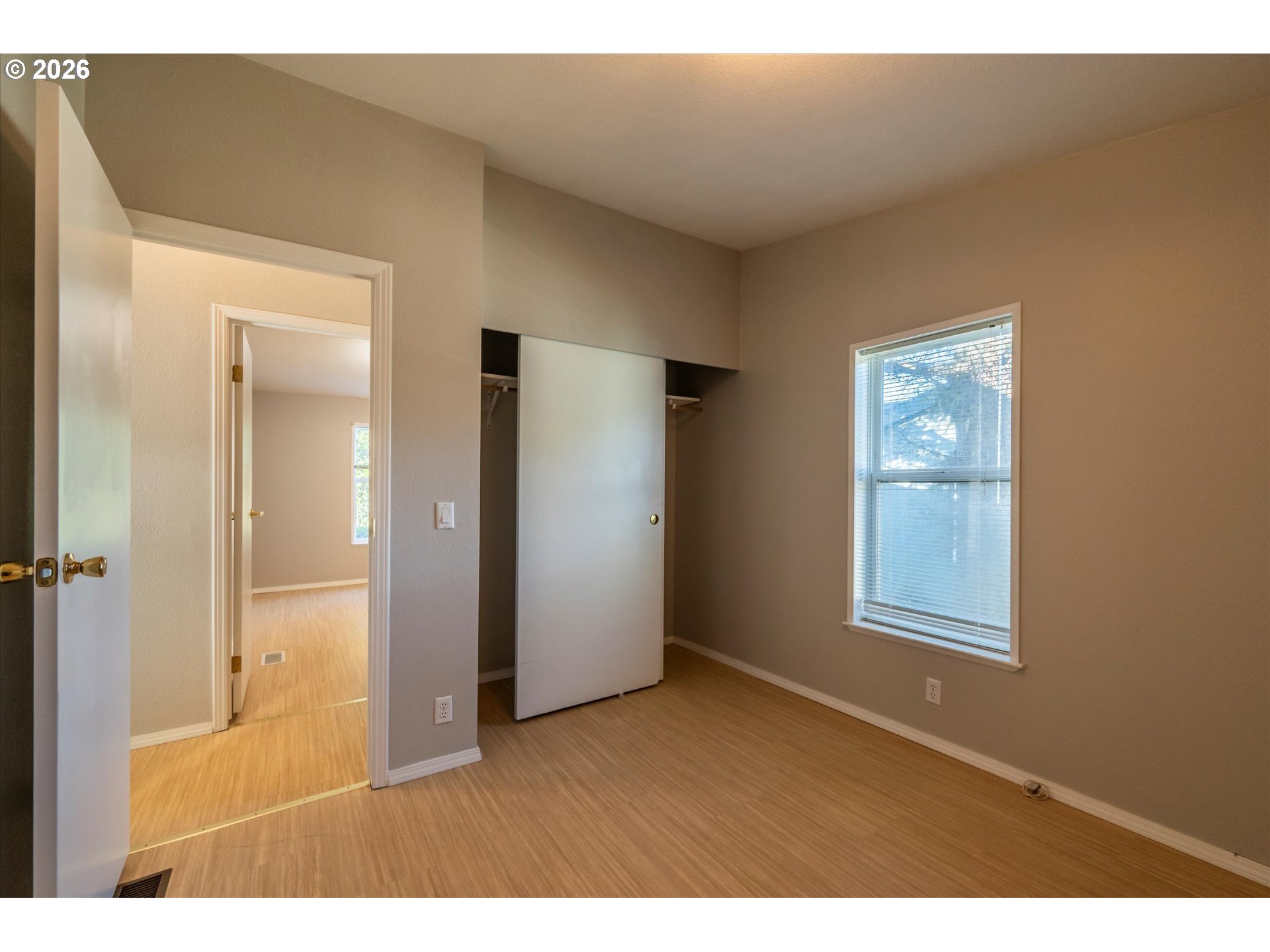 887 Jackson Avenue Southwest Bandon, OR 97411 - Photo 21 of 29 a view of an empty room and window