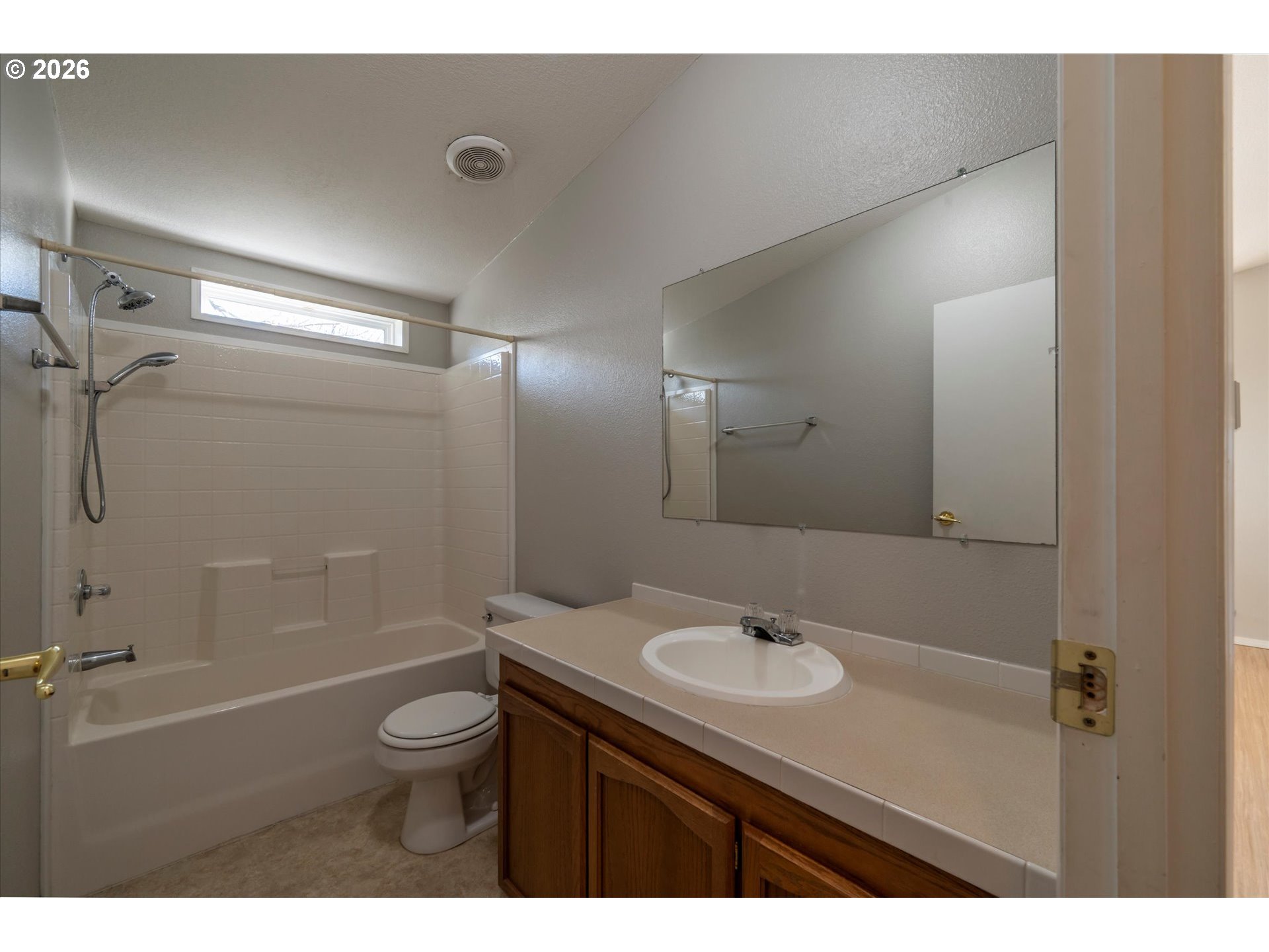 887 Jackson Avenue Southwest Bandon, OR 97411 - Photo 24 of 29 a bathroom with a sink a toilet a shower and a mirror