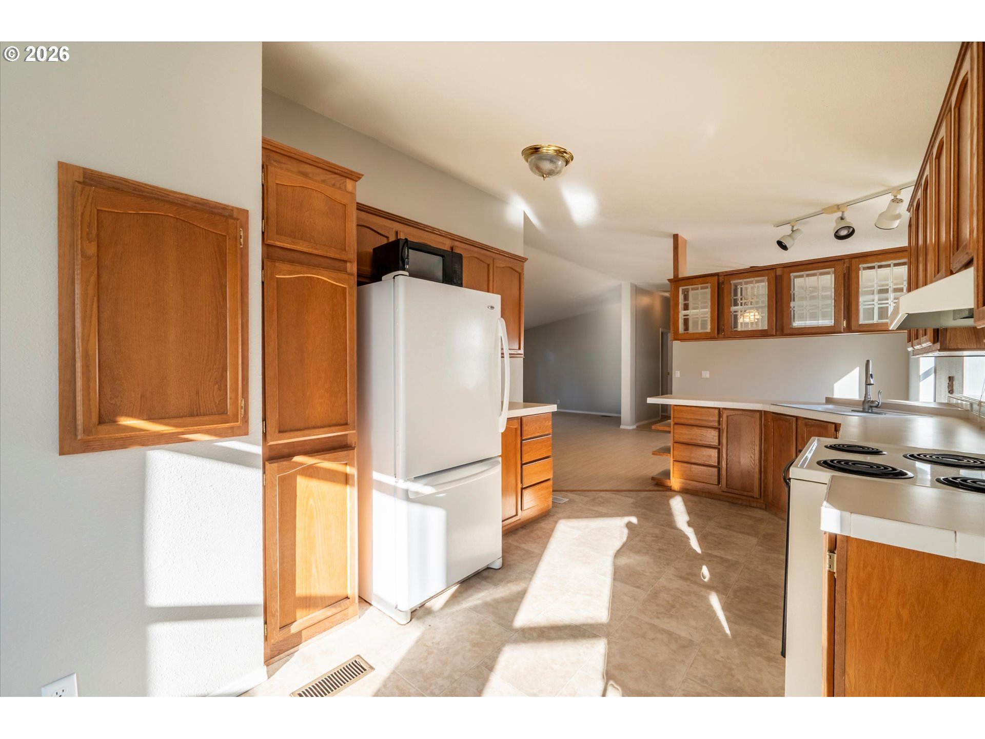 887 Jackson Avenue Southwest Bandon, OR 97411 - Photo 10 of 29 a kitchen with stainless steel appliances granite countertop a refrigerator and a stove