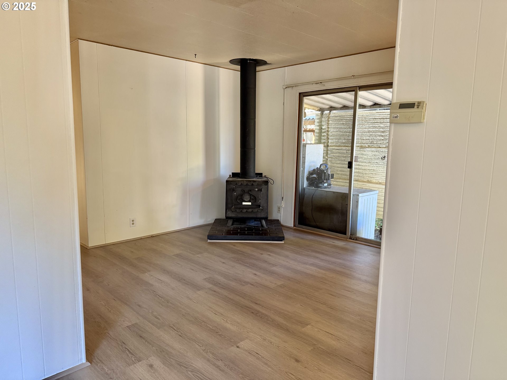 6900 Southwest 195th Avenue Beaverton, OR 97007 - Photo 12 of 21 a view of a room with wooden floor and windows