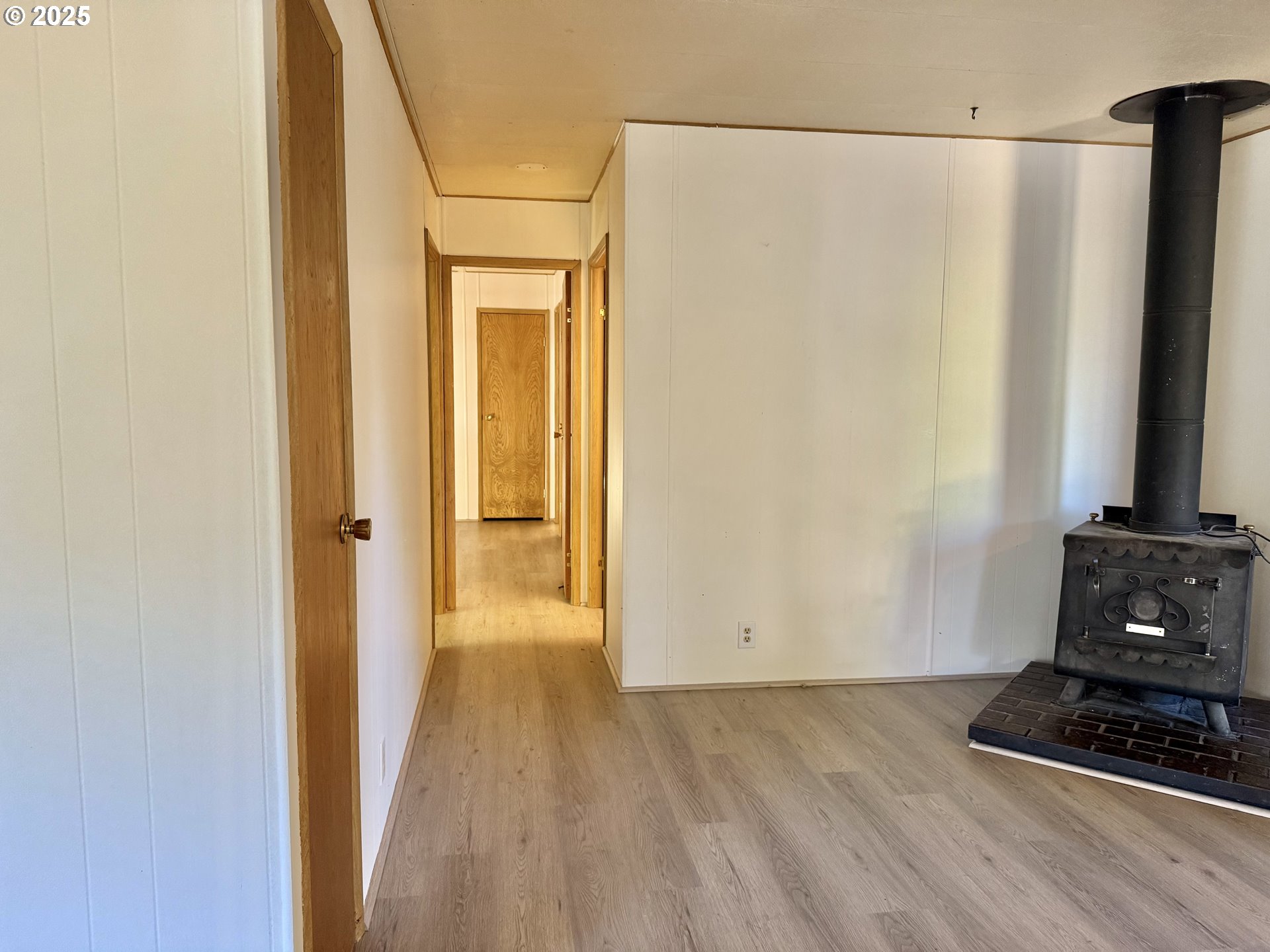 6900 Southwest 195th Avenue Beaverton, OR 97007 - Photo 13 of 21 a view of a utility room with closet and wooden floor