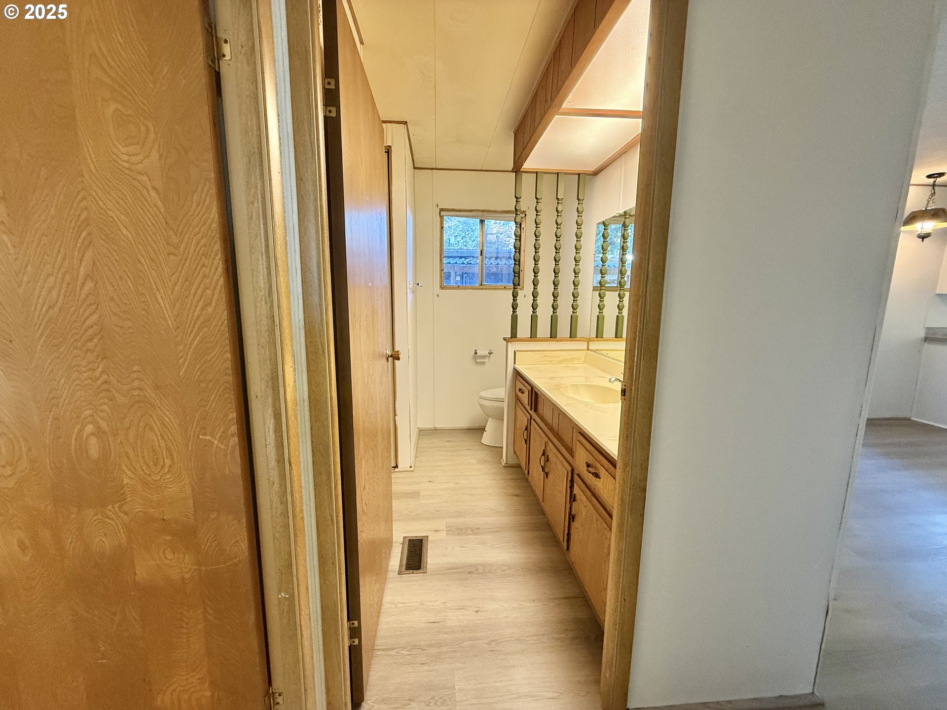6900 Southwest 195th Avenue Beaverton, OR 97007 - Photo 14 of 21 a view of a hallway with wooden floor and staircase