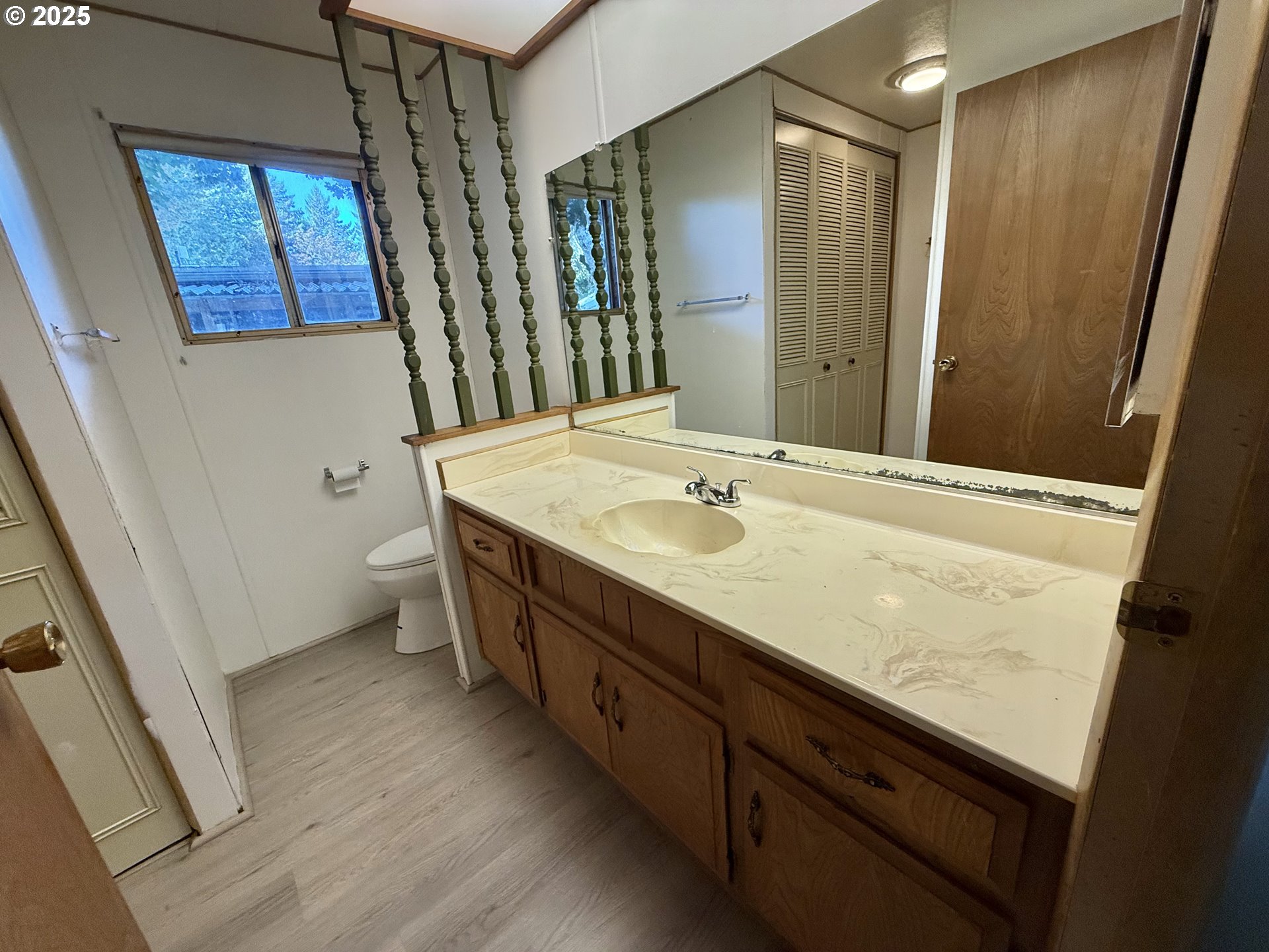 6900 Southwest 195th Avenue Beaverton, OR 97007 - Photo 15 of 21 a bathroom with a sink a mirror and a shower