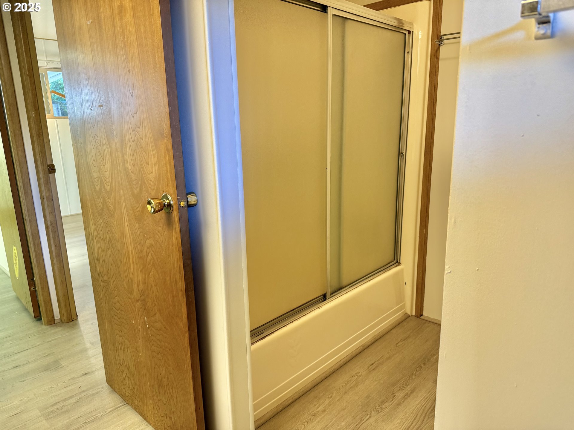 6900 Southwest 195th Avenue Beaverton, OR 97007 - Photo 16 of 21 a view of a bathroom from a hallway