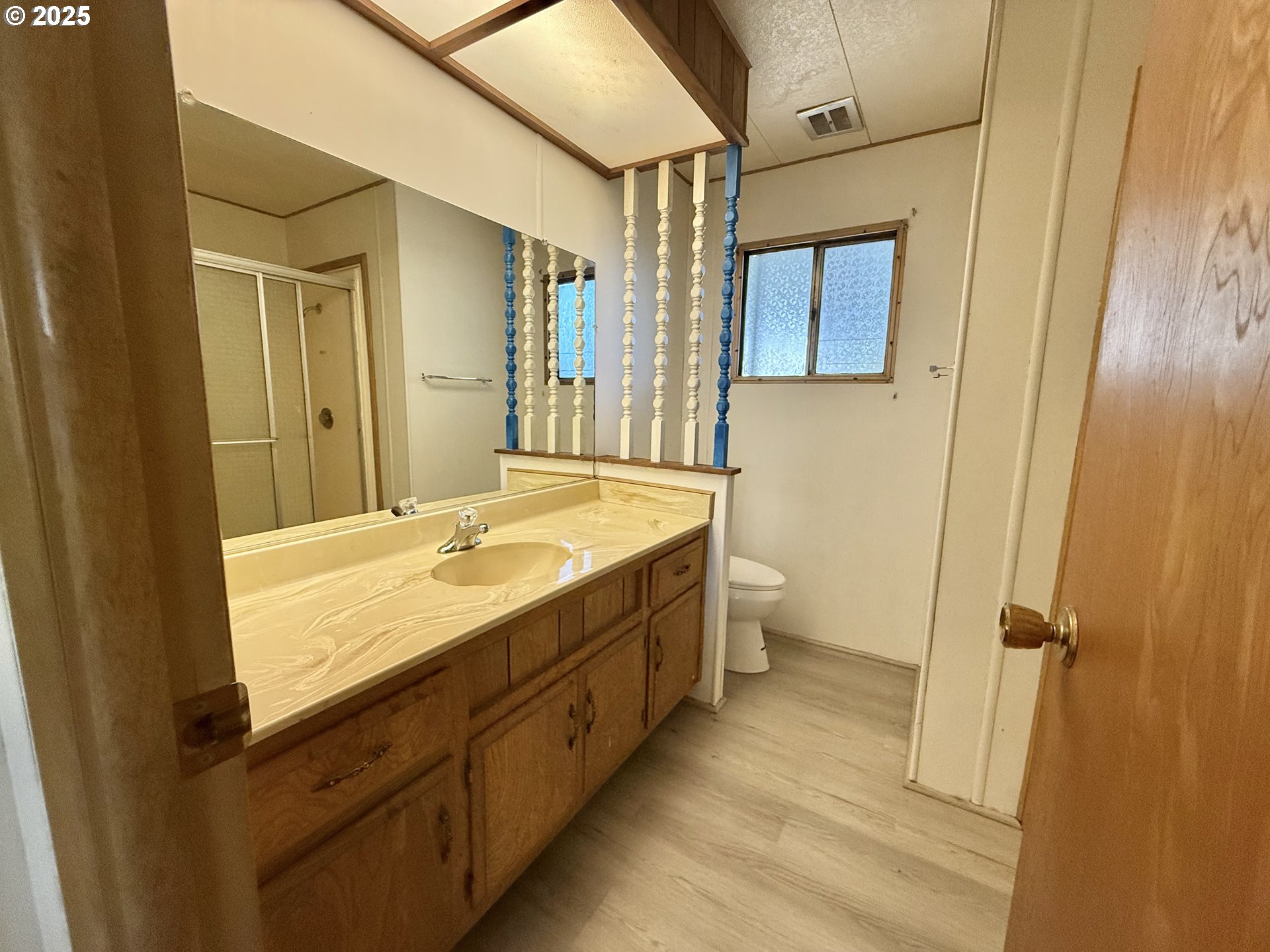 6900 Southwest 195th Avenue Beaverton, OR 97007 - Photo 20 of 21 a bathroom with a granite countertop sink toilet and shower