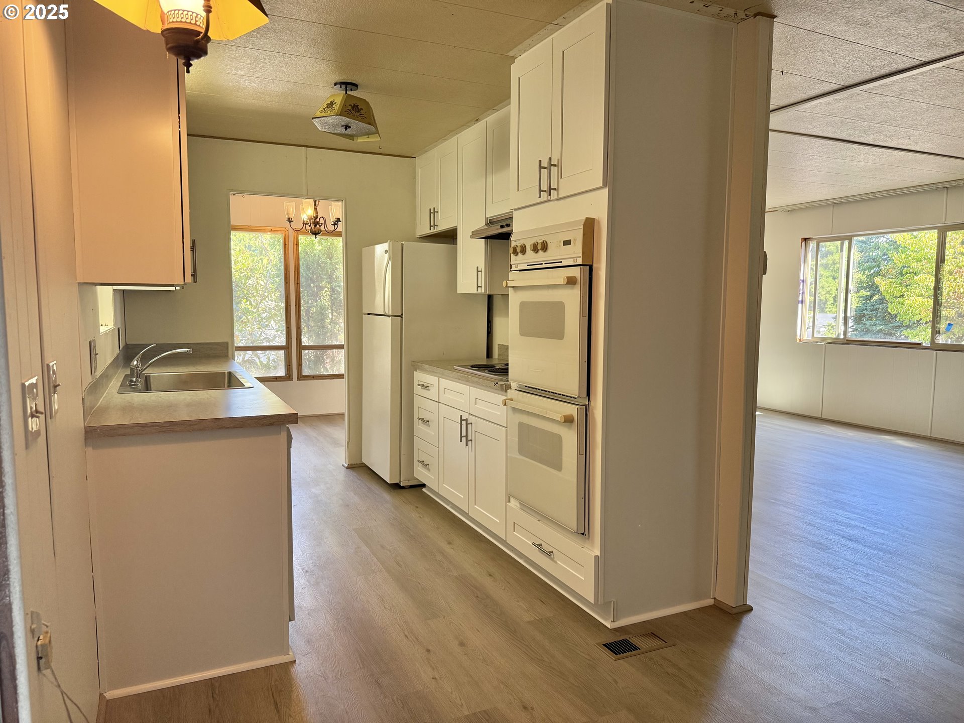 6900 Southwest 195th Avenue Beaverton, OR 97007 - Photo 10 of 21 a kitchen with stainless steel appliances a refrigerator and a stove