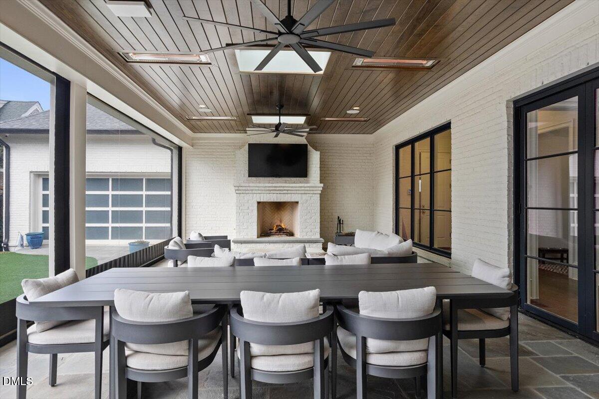 2123 St Marys Street Raleigh, NC 27608 - Photo 53 of 77 a dining room with a wooden table and chairs