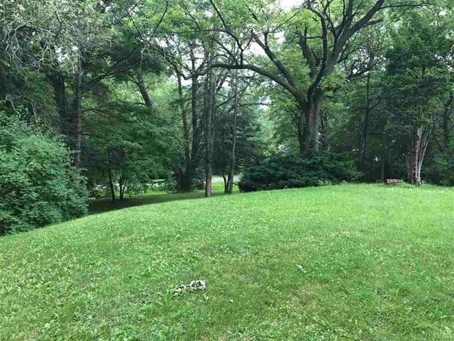3211 Landstrom Road Rockford, IL 61107 - Photo 4 of 6 a view of green field with trees in the background