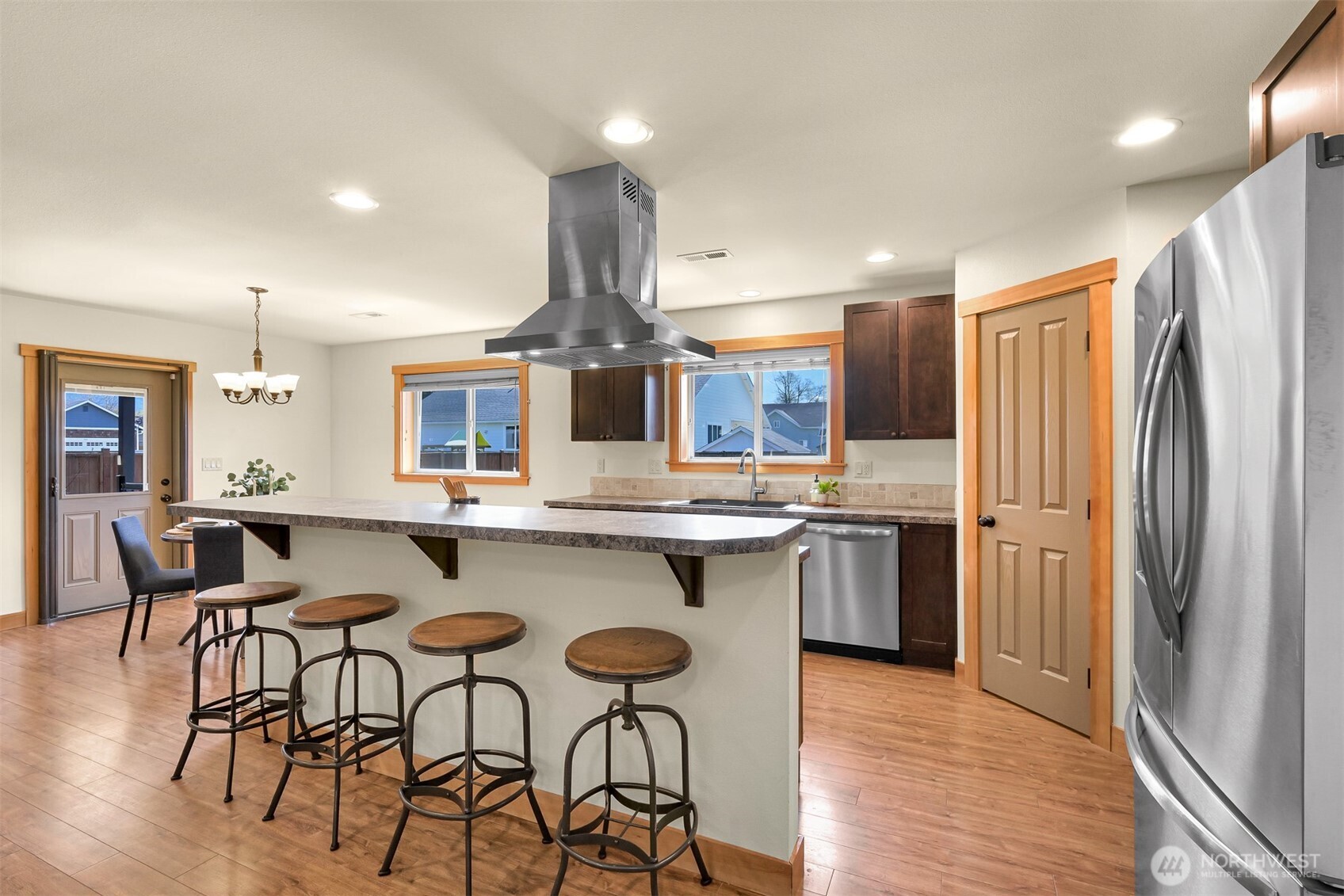 403 Westview Place Nooksack, WA 98276 - Photo 11 of 28 a kitchen with stainless steel appliances granite countertop a kitchen island hardwood floor and a sink