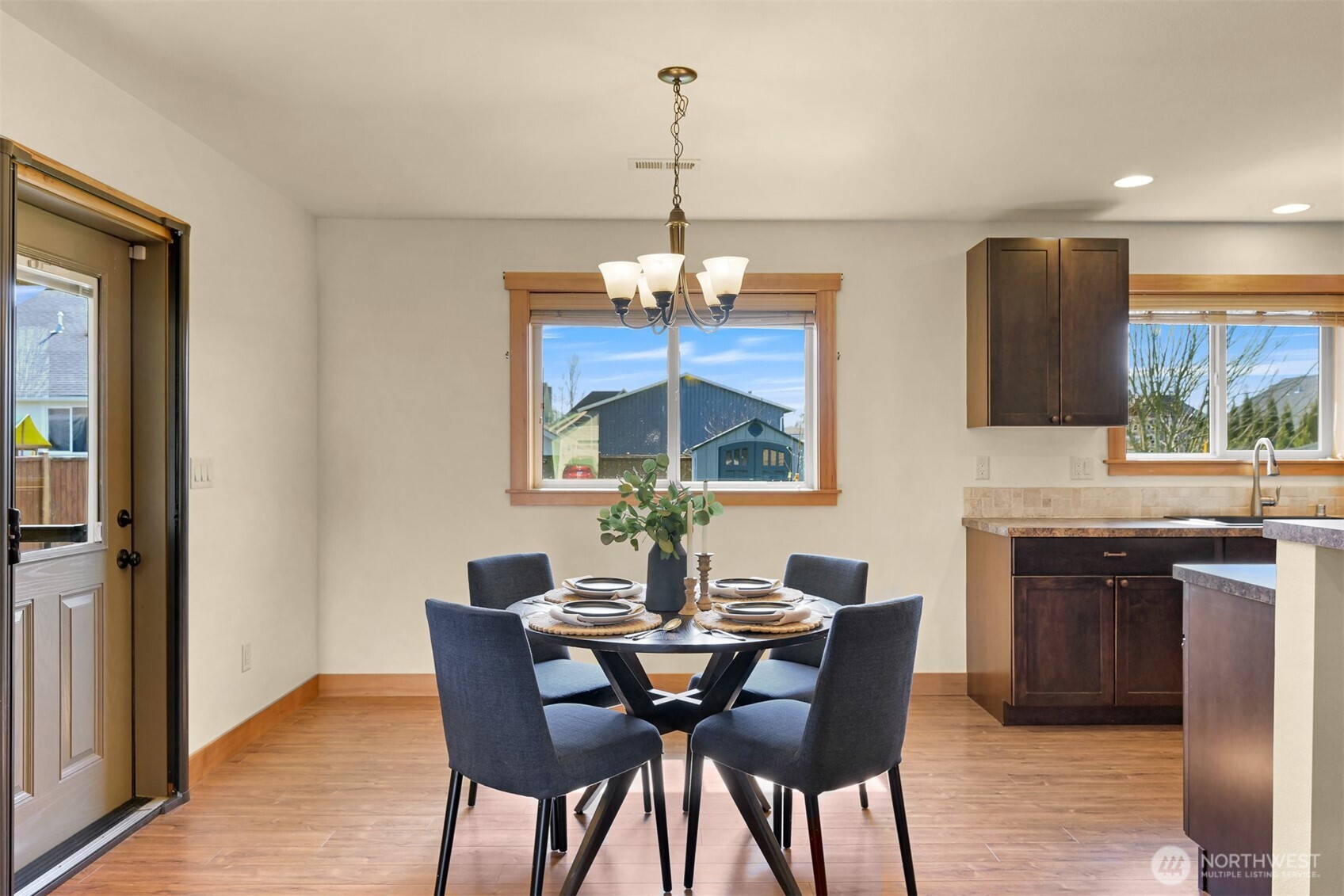 403 Westview Place Nooksack, WA 98276 - Photo 13 of 28 a dining room with furniture a chandelier and wooden floor