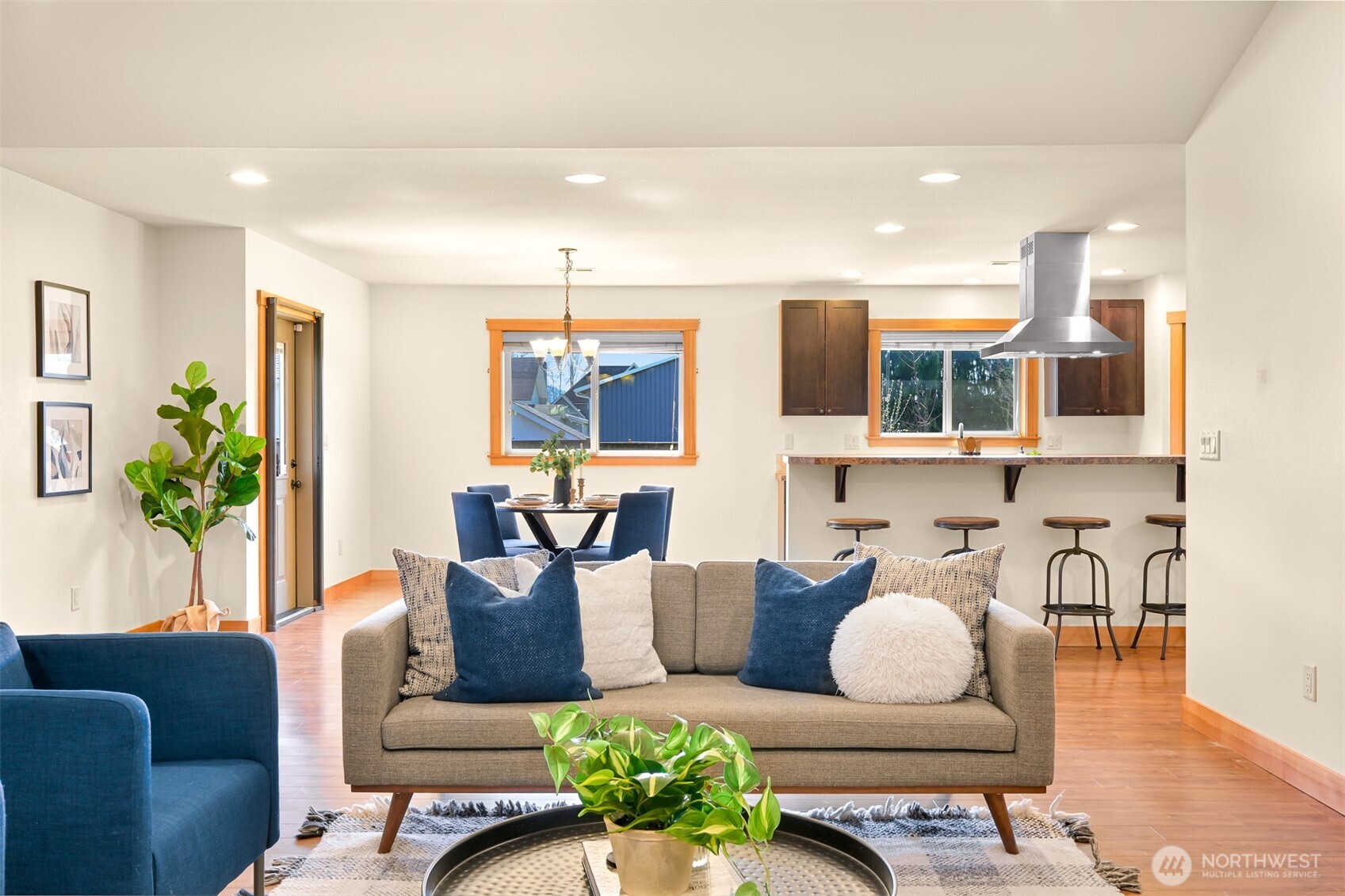403 Westview Place Nooksack, WA 98276 - Photo 6 of 28 a living room with furniture kitchen view and a wooden floor