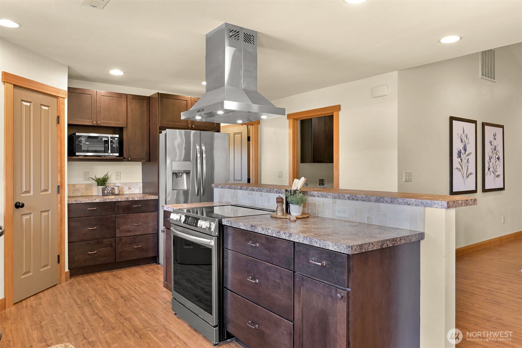 403 Westview Place Nooksack, WA 98276 - Photo 10 of 28 a kitchen with kitchen island granite countertop stainless steel appliances a sink stove and refrigerator
