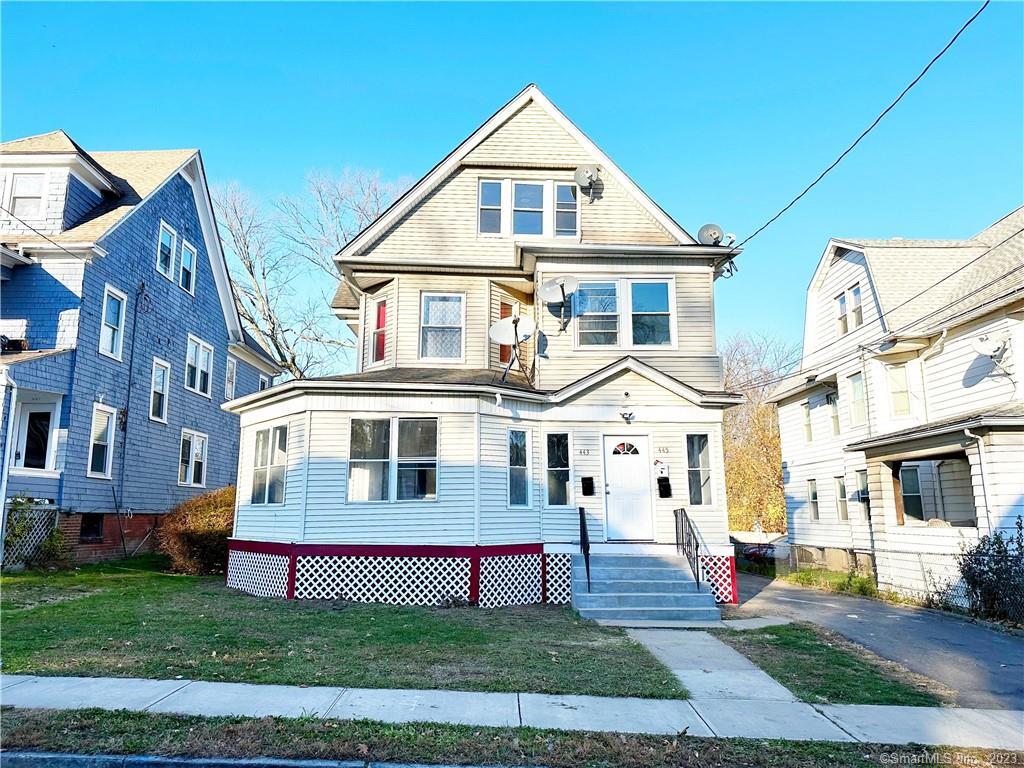 443 Edgewood Street Hartford, CT 06112 - Photo 1 of 1 a front view of a house with a yard