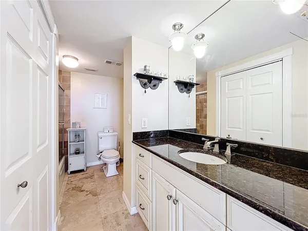 a bathroom with a shower and a toilet